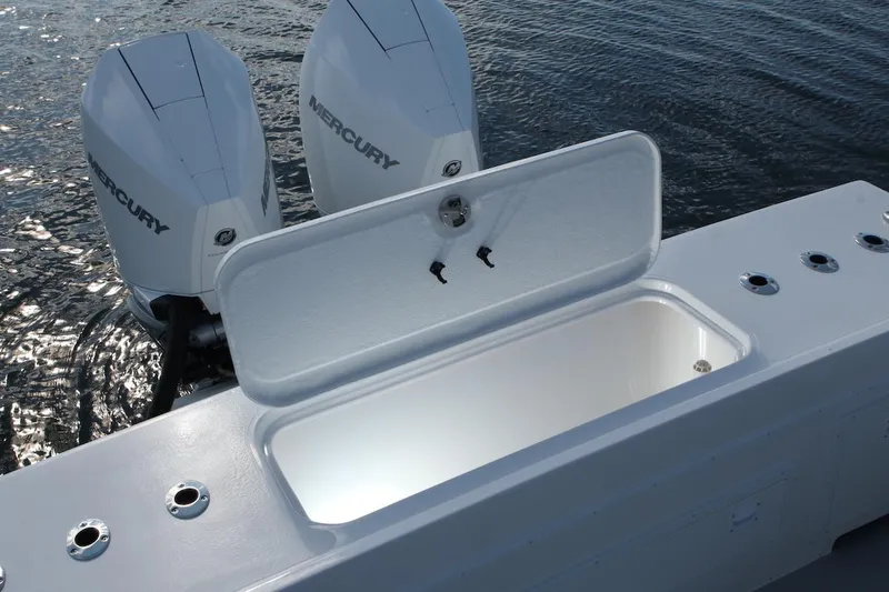 Slide: The Image of 2026 Steiger Craft 31 Fisherman boat with open storage compartment and twin Mercury engines. - 15
