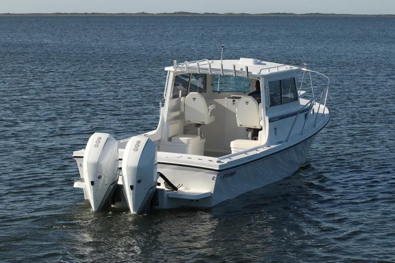 Slide: The Image of 2026 Steiger Craft 31 Fisherman boat with dual engines on open water. - 4