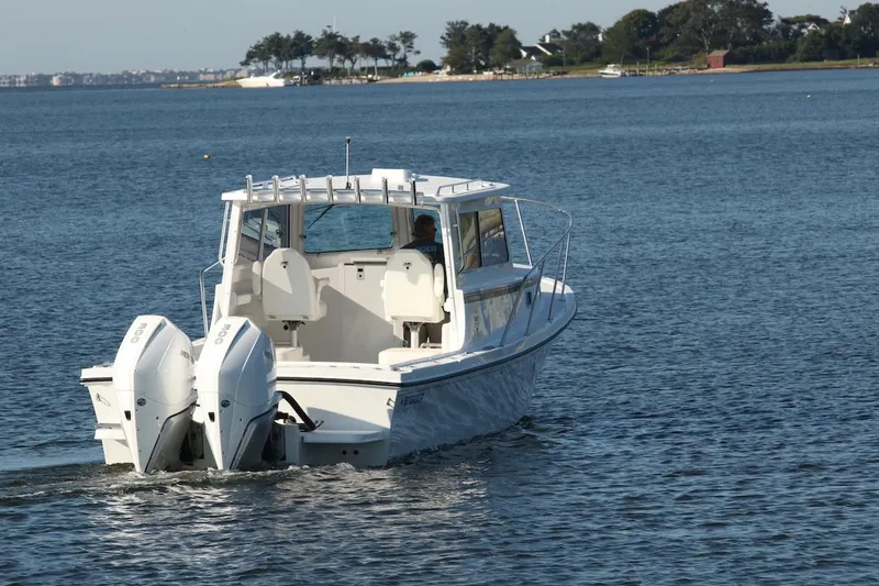 Slide: The Image of 2026 Steiger Craft 31 Fisherman boat cruising on a calm lake. - 5