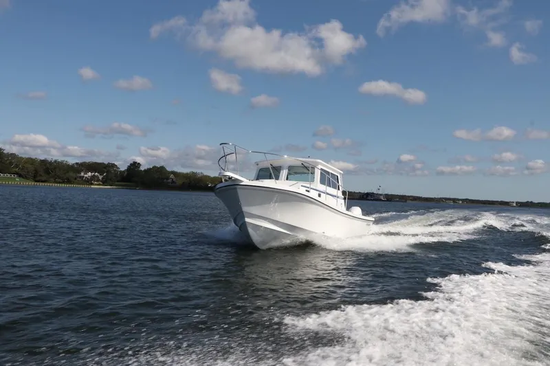 Slide: The Image of 2026 Steiger Craft 31 Fisherman cruising on a sunny day. - 9
