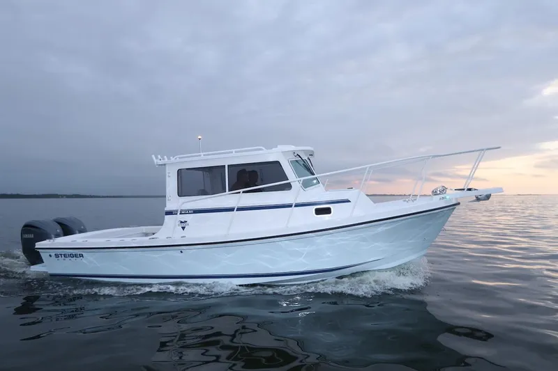 The Image of 2026 Steiger Craft 28 Miami boat cruising on calm waters at sunset. - 1