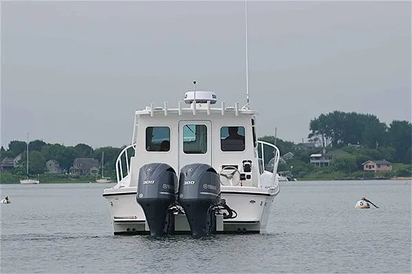 Slide: The Image of 2026 Steiger Craft 28 Miami boat with dual engines on calm water. - 13