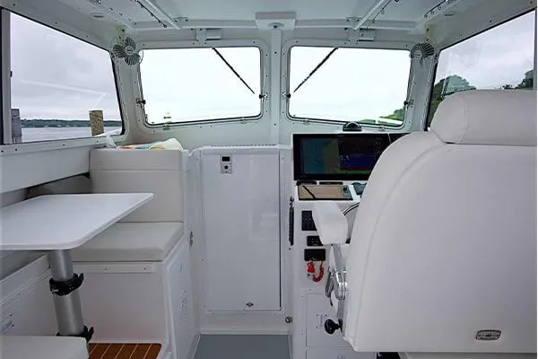 Slide: The Image of Interior of 2026 Steiger Craft 28 Miami boat with helm and seating area. - 22