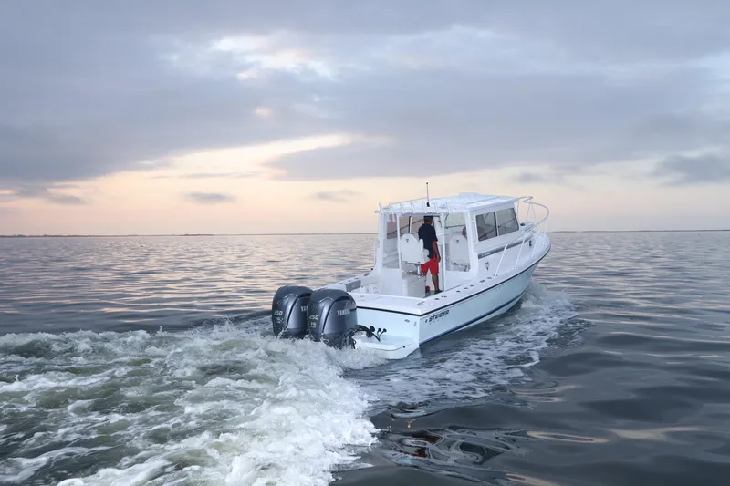 Slide: The Image of 2026 Steiger Craft 28 Miami cruising on calm waters at sunset. - 4