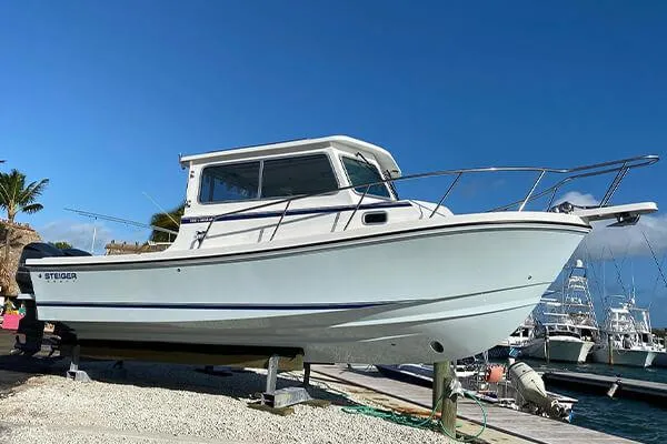 Slide: The Image of 2026 Steiger Craft 28 Miami boat on display at a marina. - 8