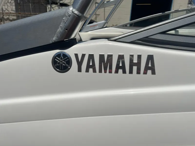 Slide: The Image of 2016 Yamaha AR190 boat logo on white hull, close-up view. - 11