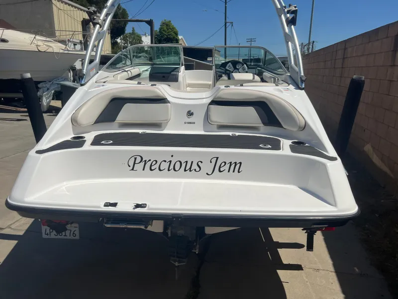 Slide: The Image of 2016 Yamaha AR190 boat named "Precious Jem" parked in a driveway. - 5
