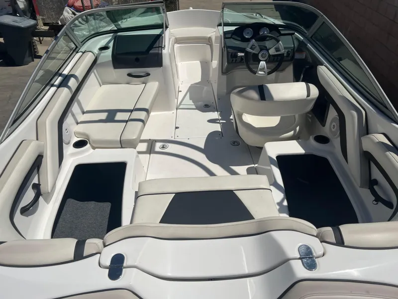 Slide: The Image of 2016 Yamaha Boats AR190 interior with seating and steering wheel, showcasing spacious design. - 6