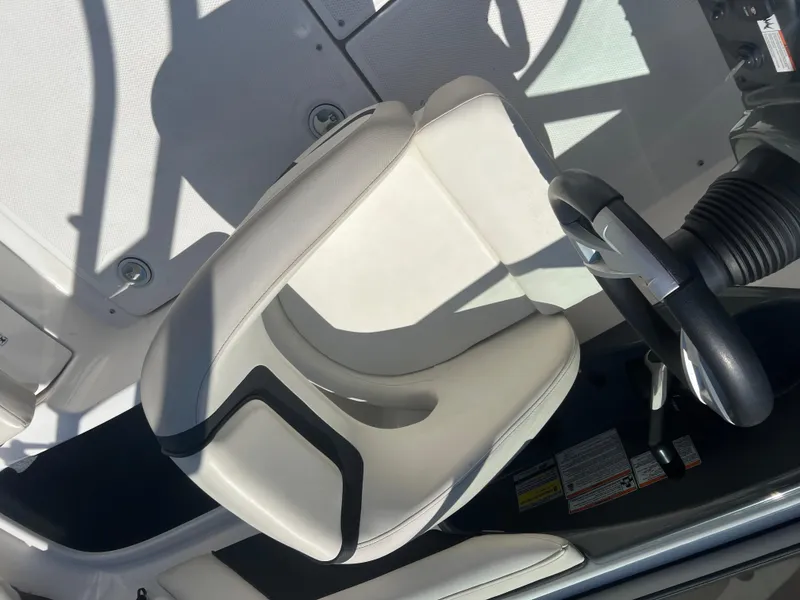 Slide: The Image of 2016 Yamaha AR190 boat cockpit with steering wheel and white seat. - 8