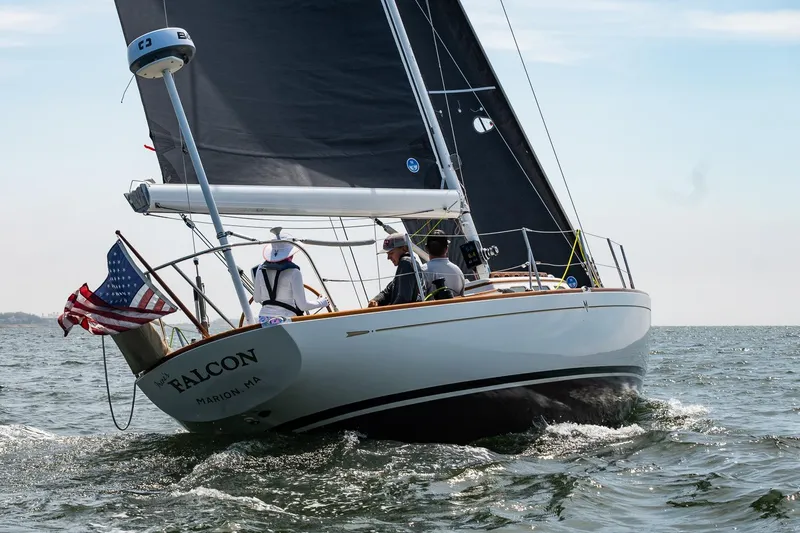 The Image of Sailing yacht "Falcon" on water, Morris M36, 2005, with American flag, sunny day. - 0