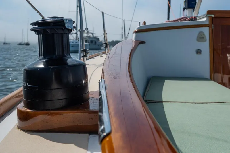 Slide: The Image of Sailboat deck of 2005 Morris M36 with winch and wooden trim, docked in marina. - 17