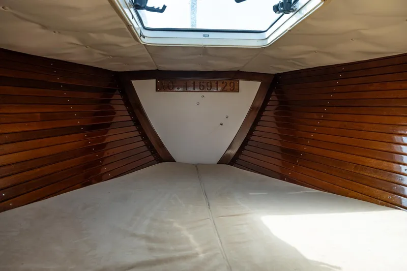 Slide: The Image of Interior of 2005 Morris M36 boat with wooden paneling and overhead hatch. - 28