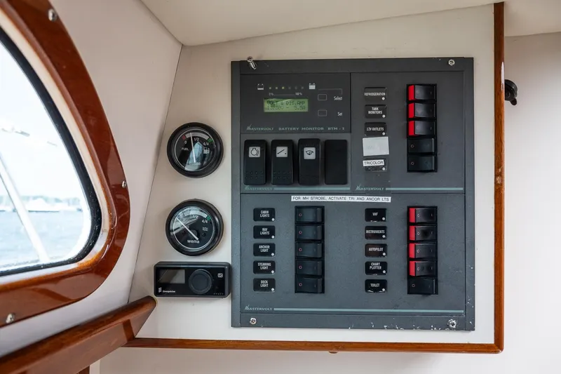Slide: The Image of Control panel of a 2005 Morris M36 boat with gauges and switches. - 31