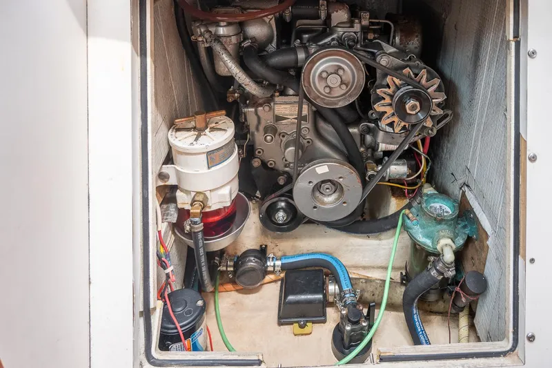 Slide: The Image of Engine compartment of a 2005 Morris M36, showcasing mechanical components and wiring. - 33