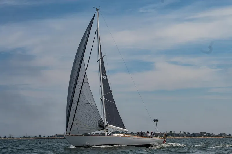 Slide: The Image of Sailing yacht Morris M36, 2005 model, gliding on open water under a clear sky. - 34