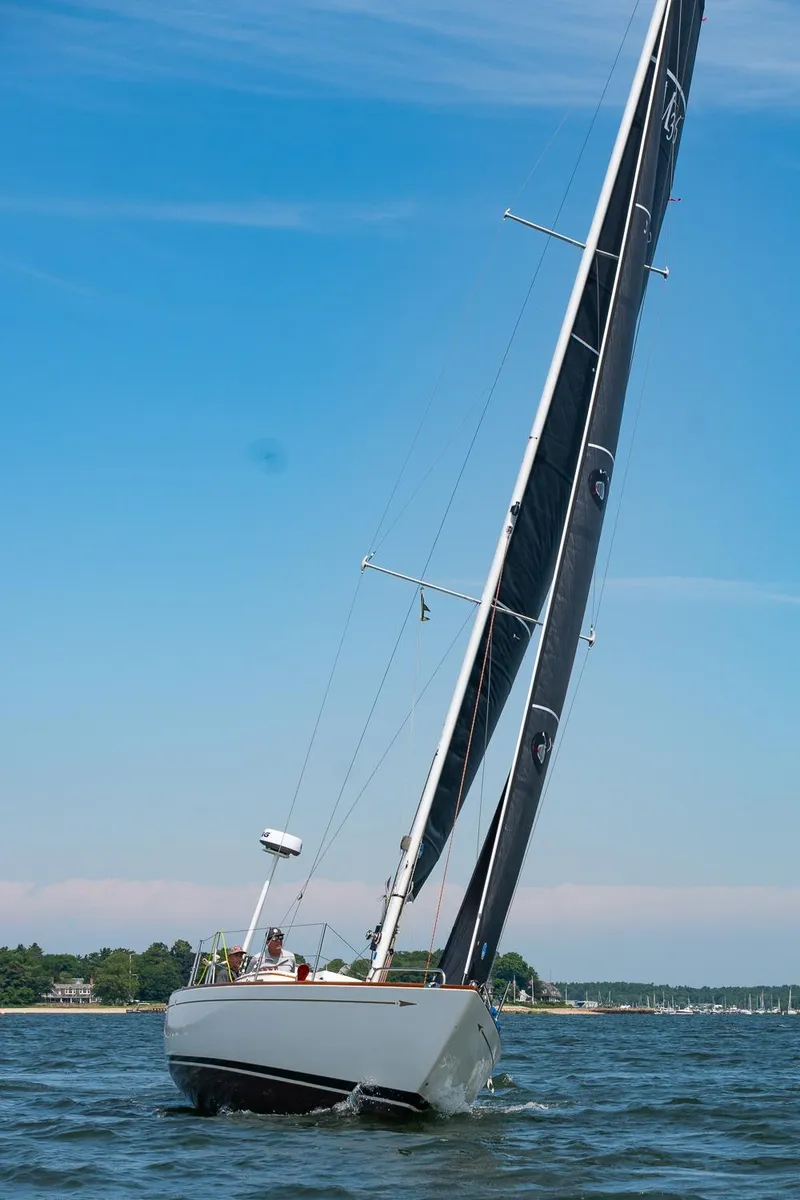 Slide: The Image of Sailing yacht Morris M36, 2005 model, gliding on a sunny day with clear blue skies. - 36