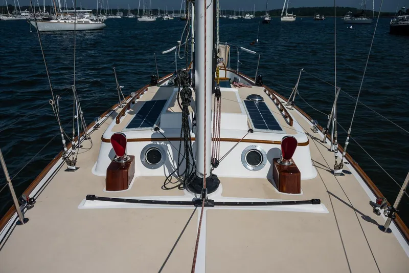 Slide: The Image of Deck view of 2005 Morris M36 sailboat with solar panels, anchored in a marina. - 7