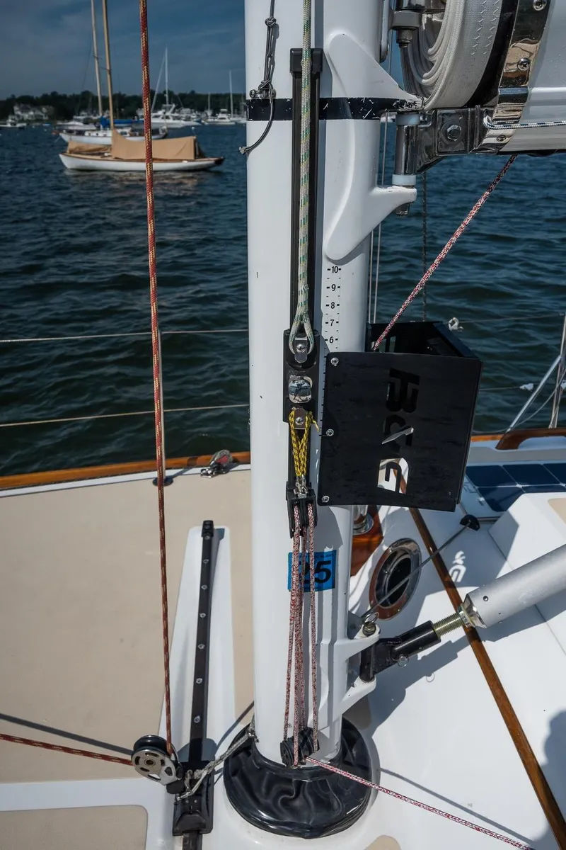 Slide: The Image of Morris M36 sailboat mast detail, 2005 model, with rigging and ropes on a sunny day. - 8