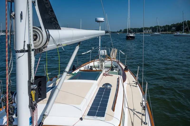 Slide: The Image of Sailing on a 2005 Morris M36 yacht, featuring a sleek deck and solar panel. - 9