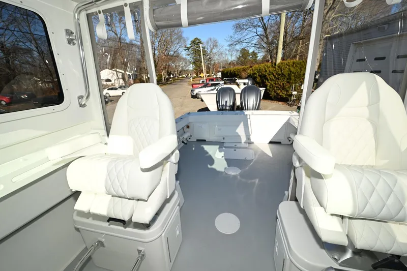 Slide: The Image of Interior of 2026 Steiger Craft 28 Fisherman boat with white seating and spacious layout. - 9