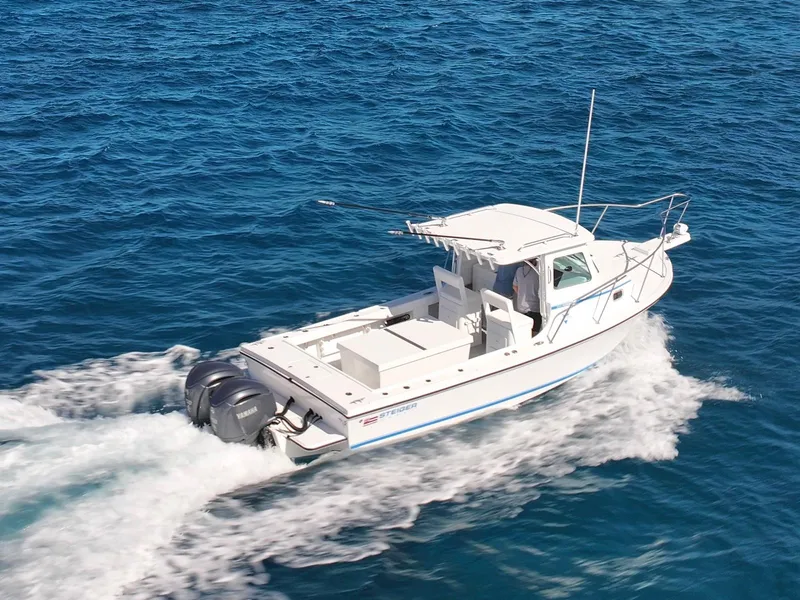 Slide: The Image of 2026 Steiger Craft 28 Hawaii boat cruising on open blue water. - 20