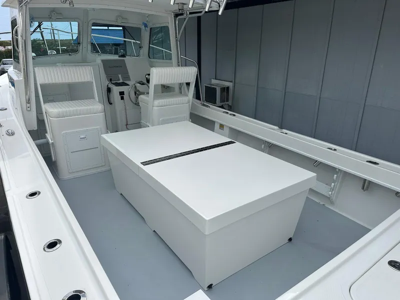 Slide: The Image of 2026 Steiger Craft 28 Hawaii boat interior with seating and control panel. - 21