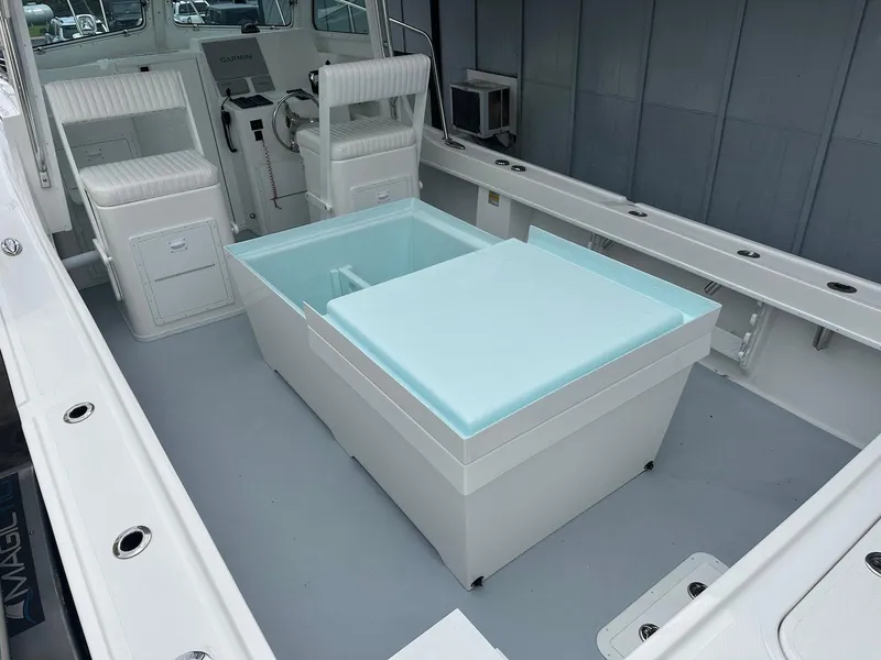 Slide: The Image of 2026 Steiger Craft 28 Hawaii boat interior with seating and storage. - 22