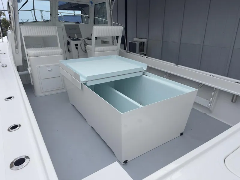 Slide: The Image of 2026 Steiger Craft 28 Hawaii boat interior with seating and storage compartment. - 25