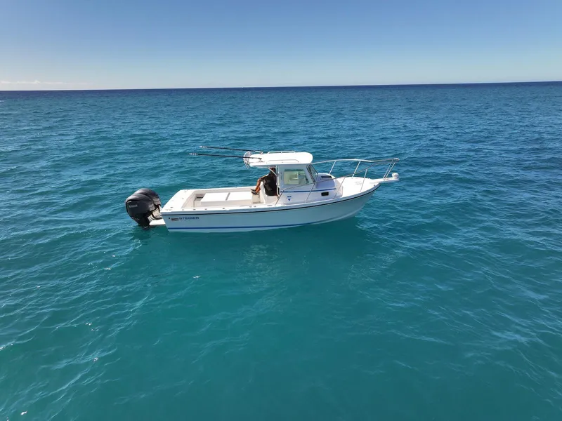 Slide: The Image of 2026 Steiger Craft 28 Hawaii boat on clear blue ocean waters. - 6
