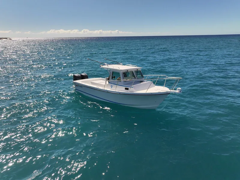 Slide: The Image of 2026 Steiger Craft 28 Hawaii boat on clear blue ocean waters. - 7