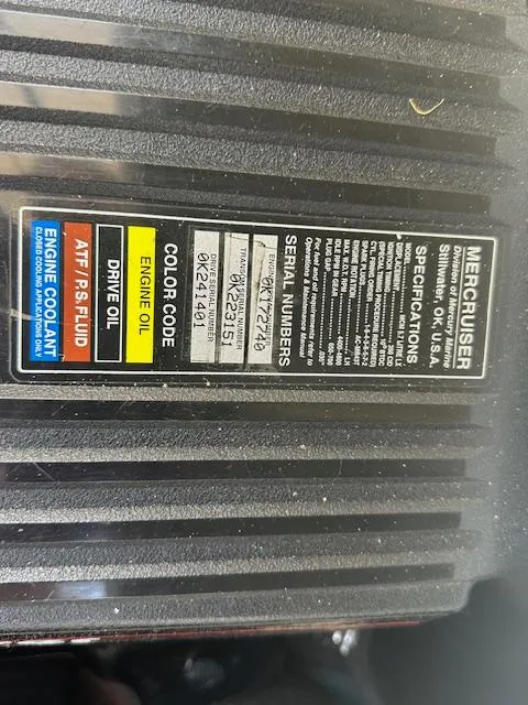 Slide: The Image of Label on MerCruiser engine with serial numbers and fluid specifications for Sea Ray 240 Sundancer. - 16