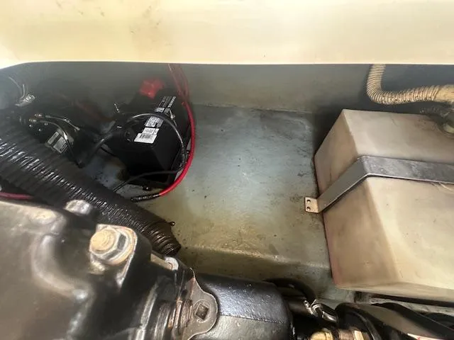 Slide: The Image of Engine compartment of a 1997 Sea Ray 240 Sundancer showing battery and components. - 17