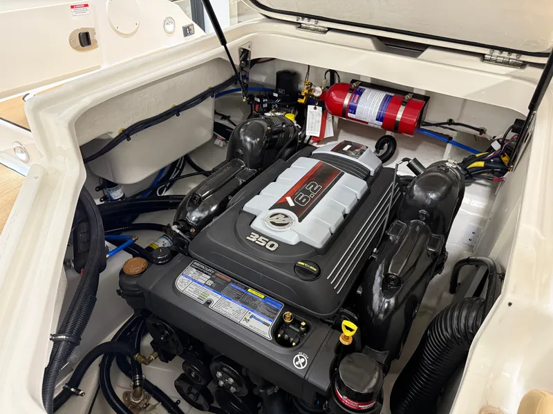 Slide: The Image of Engine compartment of 2025 Sea Ray SDX250 Surf boat, featuring a powerful 6.2L engine. - 30