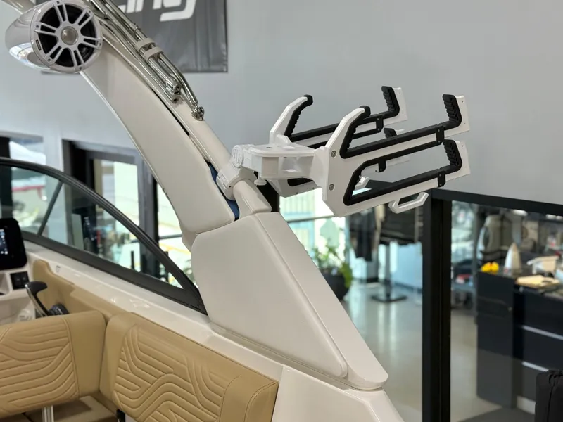 Slide: The Image of 2025 Sea Ray SDX250 Surf boat interior with wakeboard rack and speaker system. - 39