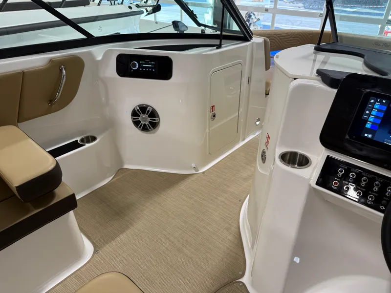 Slide: The Image of Interior of 2025 Sea Ray SDX250 Surf boat with modern controls and seating. - 46