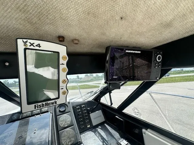 Slide: The Image of 1995 Bayliner Trophy boat dashboard with FishHawk X4 and Humminbird electronics. - 11