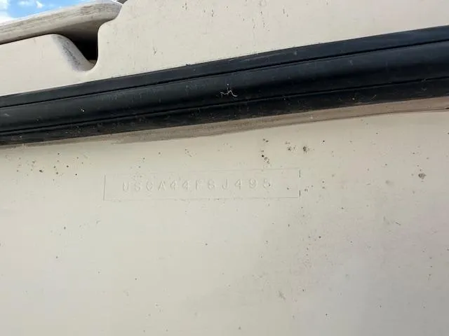 Slide: The Image of 1995 Bayliner Trophy boat hull with visible identification number. - 13