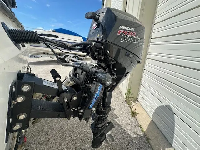 Slide: The Image of 1995 Bayliner Trophy with Mercury Pro Kicker outboard motor in a storage area. - 6