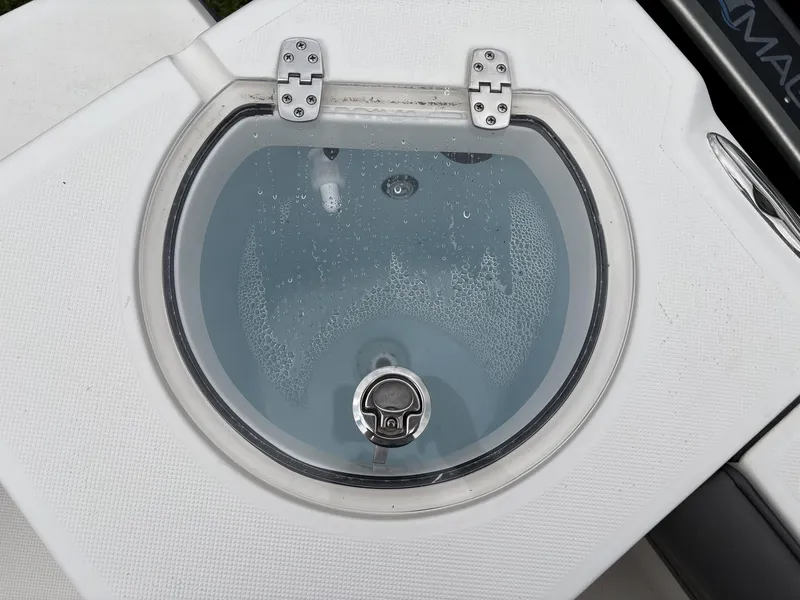 Slide: The Image of 2023 Sea Born LX22 boat livewell with clear lid and water droplets. - 14
