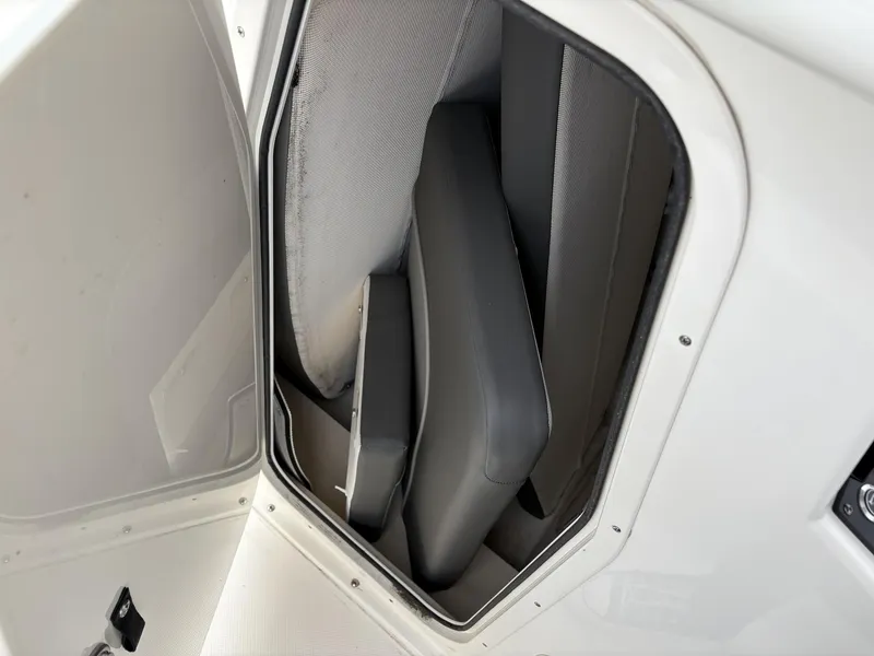 Slide: The Image of 2023 Sea Born LX22 boat storage compartment with cushioned seating. - 17