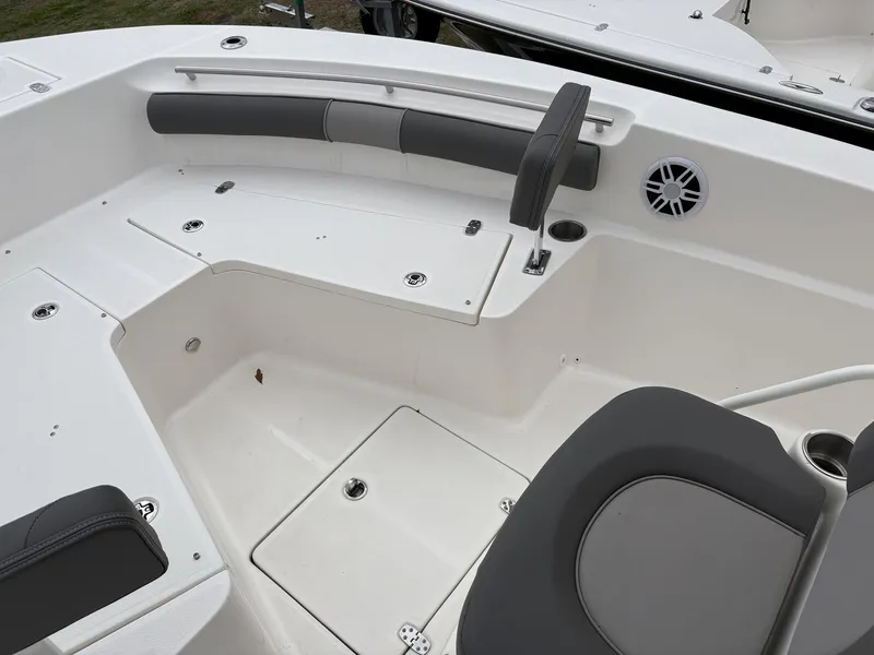 Slide: The Image of 2023 Sea Born LX22 boat interior with seating and storage compartments. - 19