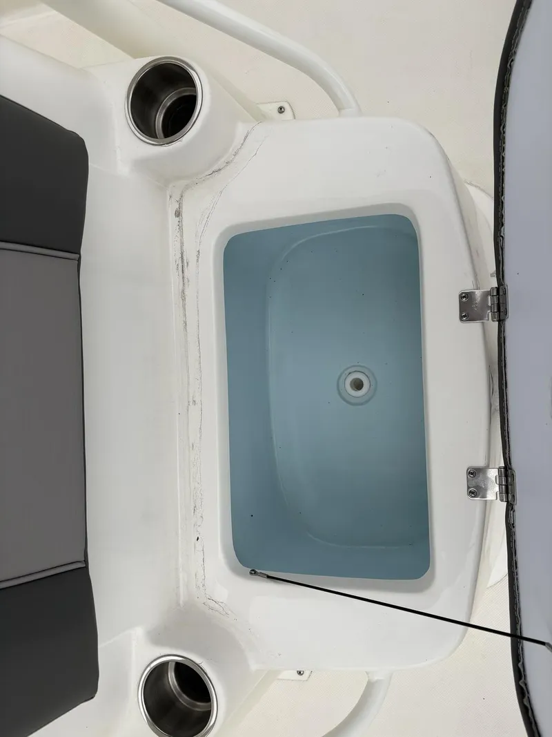 Slide: The Image of 2023 Sea Born LX LX22 boat interior with livewell and cup holders. - 21
