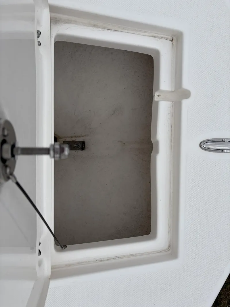 Slide: The Image of Open storage compartment on 2023 Sea Born LX LX22 boat. - 24