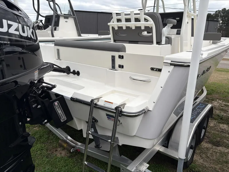 Slide: The Image of 2023 Sea Born LX LX22 boat with Suzuki outboard motor and trailer ladder. - 4