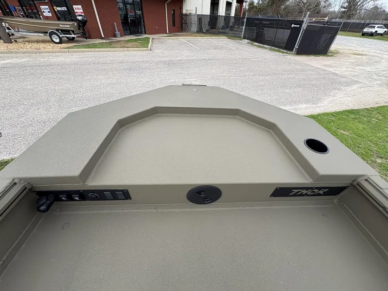 Slide: The Image of 2025 Thor Lake Hammer Hybrid 1754 boat deck, featuring control panel and cup holder. - 10