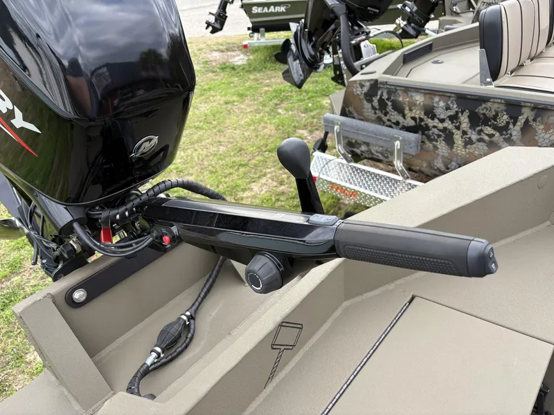 Slide: The Image of 2025 Thor Lake Hammer Hybrid 1754 boat with Mercury outboard motor, featuring a camouflage design. - 11