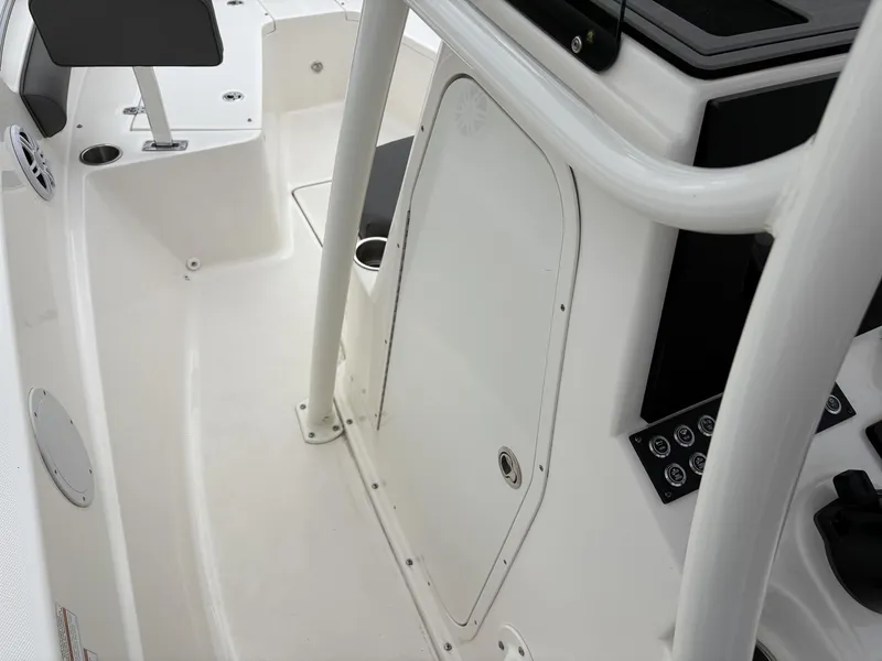 Slide: The Image of 2023 Sea Born LX LX22 boat interior with console and seating area. - 16