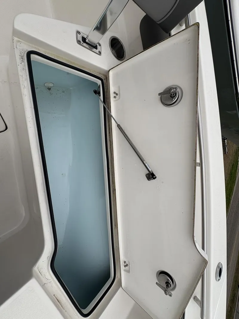 Slide: The Image of Open storage compartment on 2023 Sea Born LX LX22 boat. - 23