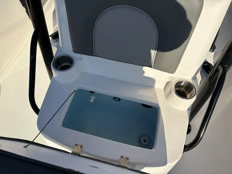 Slide: The Image of 2024 Sea Born FX FX24 boat seat with integrated storage and cup holders. - 13