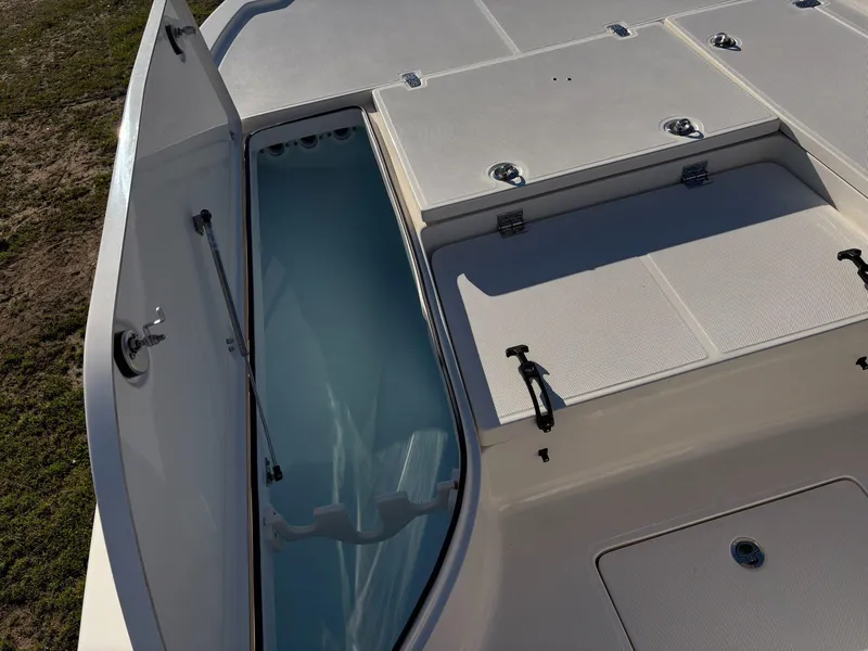 Slide: The Image of 2024 Sea Born FX FX24 boat storage compartments and open hatch. - 15